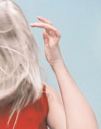 Close-up portrait of a girl with hands