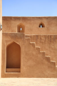 Low angle view of historic building against clear sky