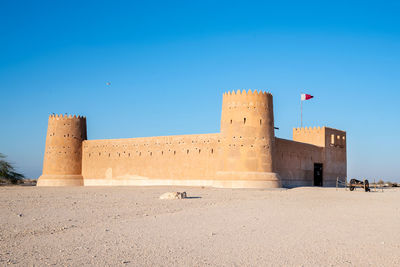 View of fort against clear blue sky