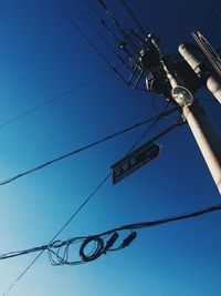 Low angle view of electricity pylon