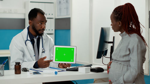 Female doctor working in office