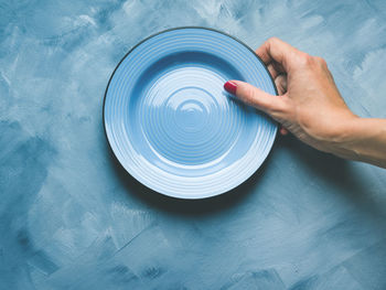 High angle view of person hand on table