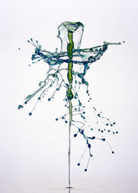 Close-up of water over white background