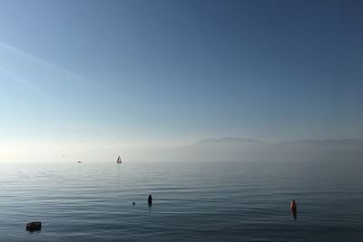 Scenic view of sea against clear blue sky