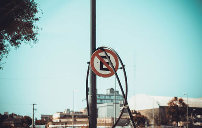 View of road sign against clear sky