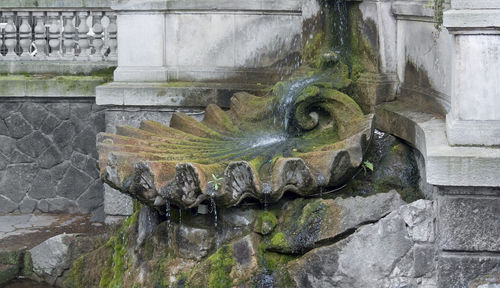 Old fountain against wall