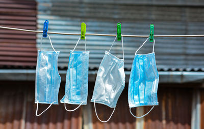 Close-up of clothes hanging on clothesline