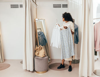 Portrait of young woman standing in bathroom