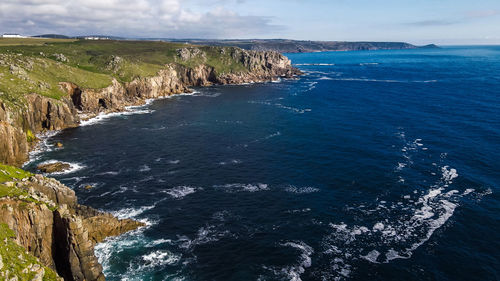 Waves crashing on the rocks of the coast aerial view