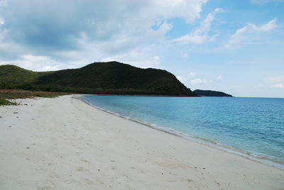 Scenic view of beach against sky