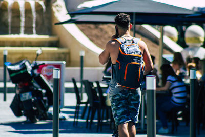 Rear view of man standing outdoors