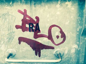 Close-up of graffiti on wall