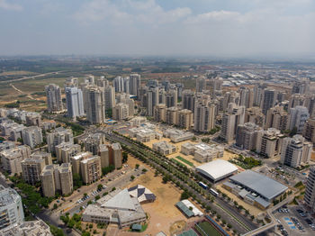 High angle view of buildings in city against sky