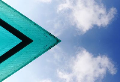 Low angle view of road sign against sky