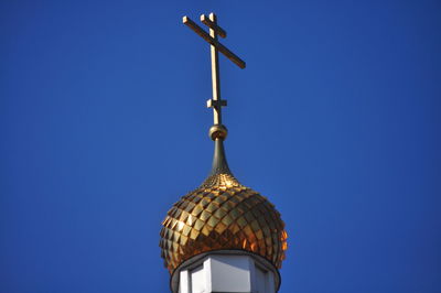 Low angle view of traditional building against clear blue sky