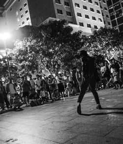 Crowd in town square at night