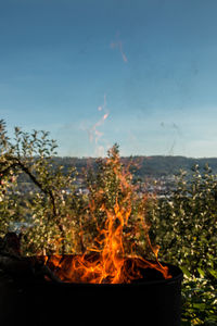 Scenic view of bonfire against sky