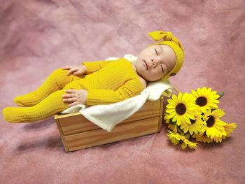 Portrait of cute girl with teddy bear on table