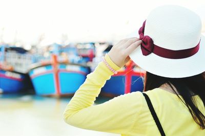 Rear view of woman wearing hat against sky