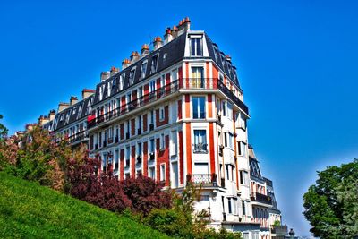 Low angle view of building against blue sky