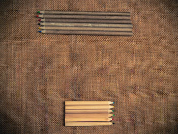 Directly above shot of pencils on burlap