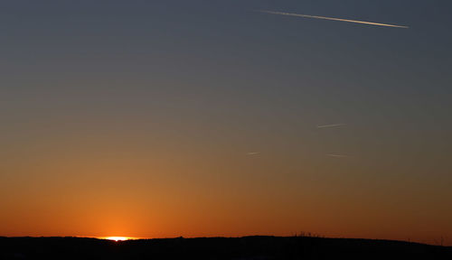 Scenic view of silhouette landscape against sky during sunset