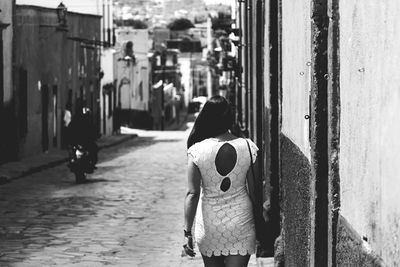 Woman standing in city