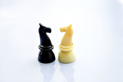 Close-up of chess against white background