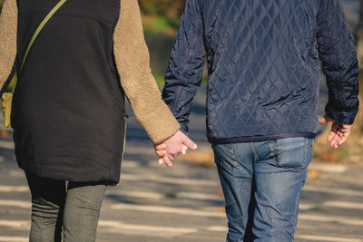 Rear view of couple standing outdoors