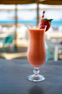 A tasty refreshing tropical fruit smoothie along the mediterranean coast at a beach bar