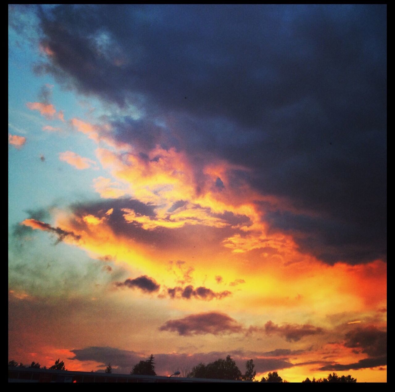 transfer print, sunset, sky, cloud - sky, auto post production filter, orange color, beauty in nature, scenics, dramatic sky, silhouette, cloudy, nature, cloud, tranquility, low angle view, weather, tranquil scene, overcast, moody sky, idyllic