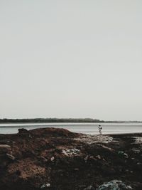 Scenic view of beach against clear sky