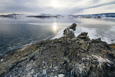 Scenic view of sea against sky during winter