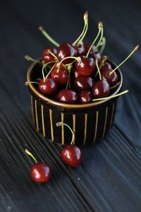 High angle view of strawberries in basket on table