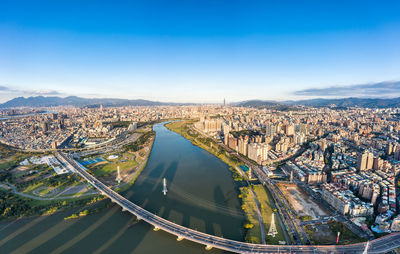 High angle view of bridge and buildings against sky