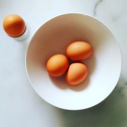 High angle view of eggs in plate