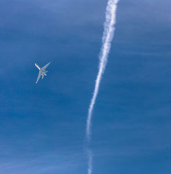 Low angle view of vapor trail in sky