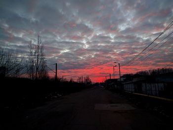 Road against dramatic sky during sunset