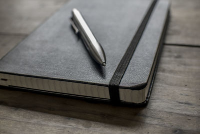 Close-up of pen on diary