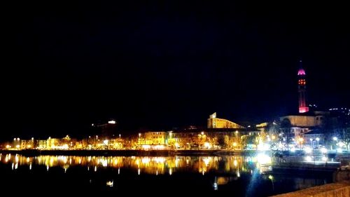 Reflection of illuminated buildings in water