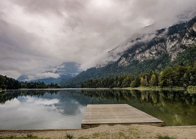 View of calm lake against mountain range