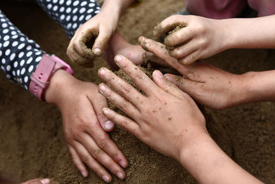 Midsection of couple hands