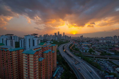 High angle view of city at sunset