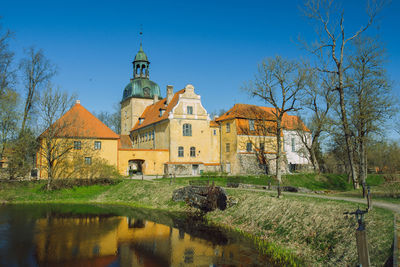 Plants by building against sky