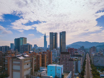 Modern buildings in city against sky