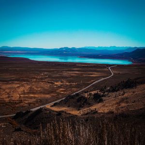 Scenic view of landscape against blue sky