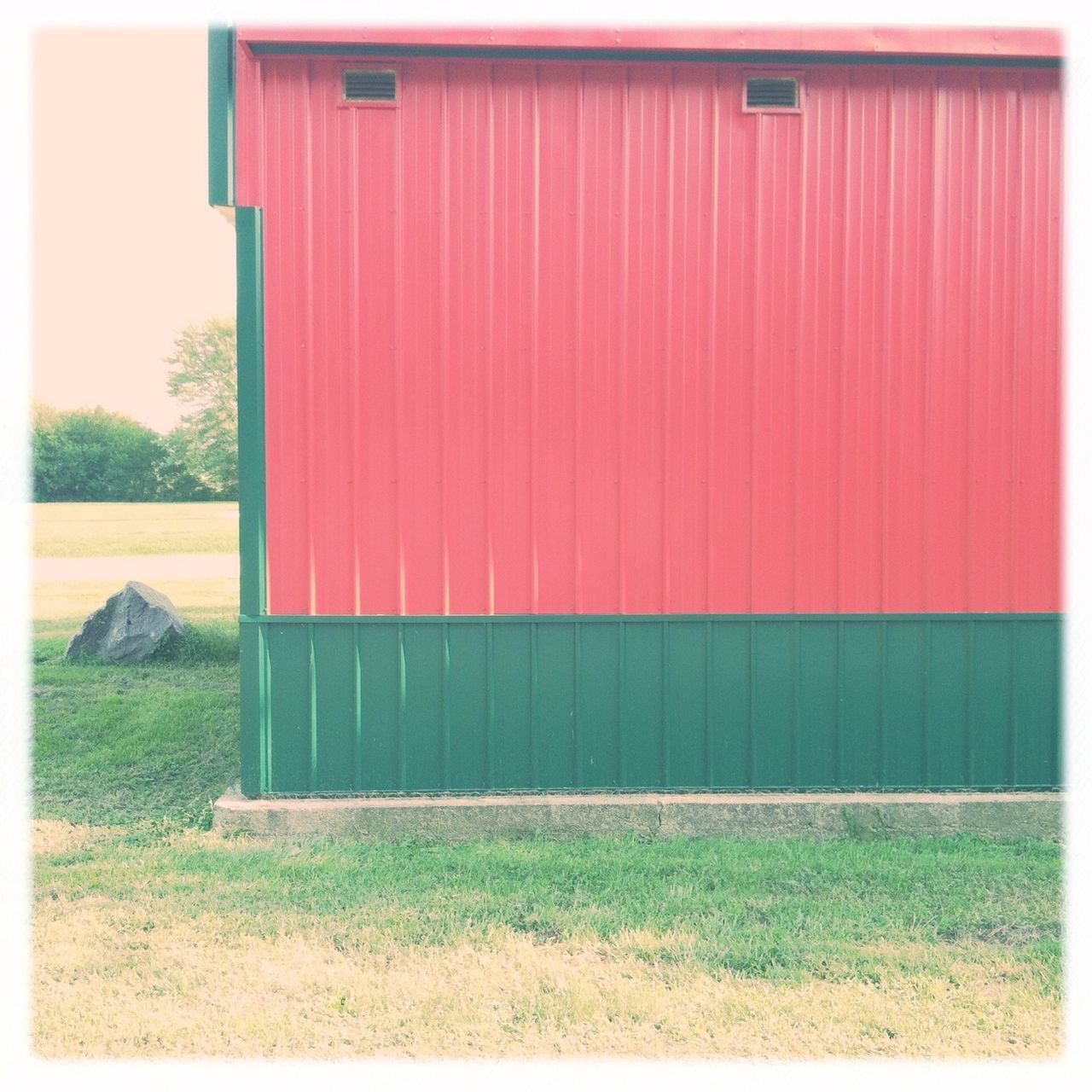 building exterior, built structure, architecture, transfer print, house, auto post production filter, red, grass, door, day, no people, outdoors, residential structure, closed, window, field, tree, wall - building feature, sunlight, sky