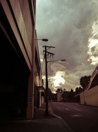 Built structure against cloudy sky at sunset