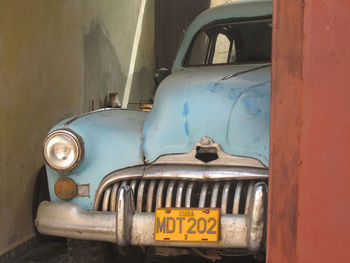 Old blue vintage car in garage