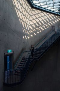 High angle view of man on staircase
